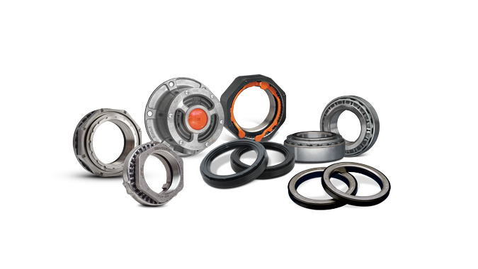 Assortment of metal bearings, seals, and circular mechanical components arranged on a white background, including a large hub with an orange center.